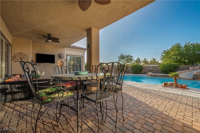 7670 Frittata Ave, Las Vegas, NV 89113 - fenced backyard featuring ceiling fan, a patio, and outdoor dining area