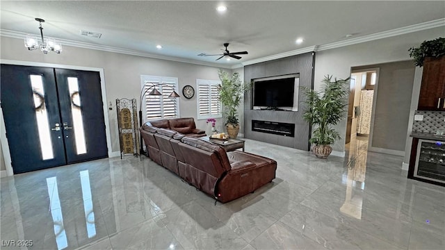 2891 S Rainbow Ave, Pahrump, NV 89048 - living room with light marble finish flooring, beverage cooler, recessed lighting, plenty of natural light, and french doors