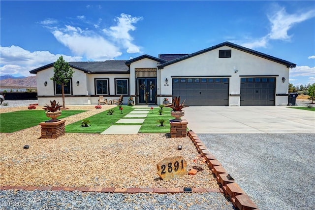2891 S Rainbow Ave, Pahrump, NV 89048 - single story home featuring concrete driveway, stucco siding, an attached garage, and a front yard