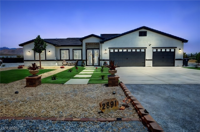 2891 S Rainbow Ave, Pahrump, NV 89048 - ranch-style house featuring driveway, a garage, and stucco siding