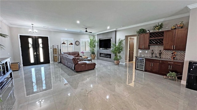 2891 S Rainbow Ave, Pahrump, NV 89048 - living room with light marble finish flooring, wine cooler, french doors, recessed lighting, and a ceiling fan