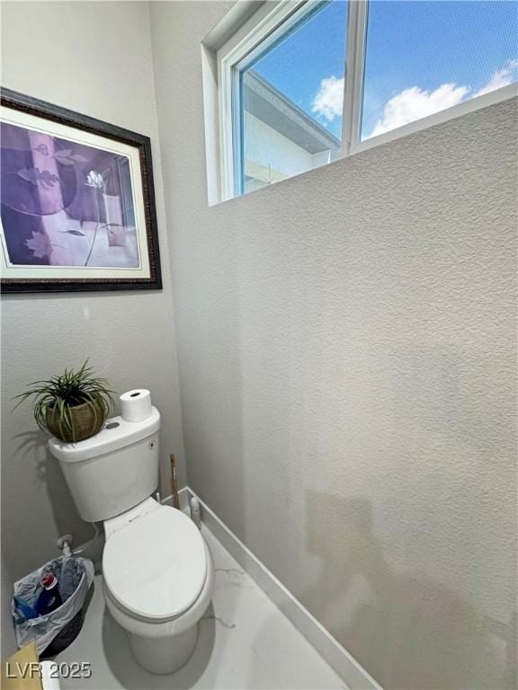 2891 S Rainbow Ave, Pahrump, NV 89048 - bathroom featuring toilet and marble finish floors