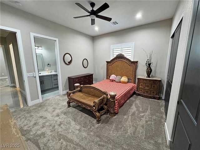 2891 S Rainbow Ave, Pahrump, NV 89048 - bedroom featuring carpet floors, connected bathroom, a ceiling fan, and recessed lighting
