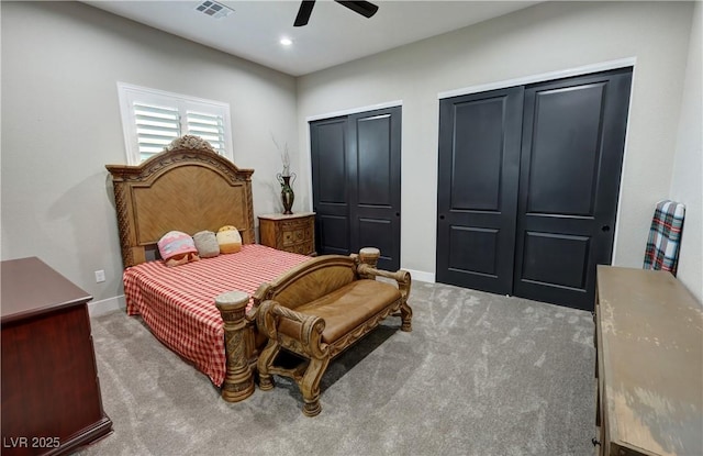 2891 S Rainbow Ave, Pahrump, NV 89048 - bedroom featuring carpet, two closets, ceiling fan, and recessed lighting