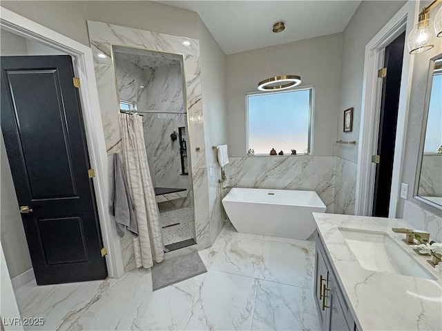 2891 S Rainbow Ave, Pahrump, NV 89048 - bathroom with vanity, a marble finish shower, marble tiled flooring, a freestanding tub, and tile walls