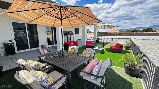 2891 S Rainbow Ave, Pahrump, NV 89048 - fenced backyard with a mountain view and a patio
