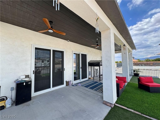 2891 S Rainbow Ave, Pahrump, NV 89048 - view of patio / terrace with ceiling fan and outdoor lounge area