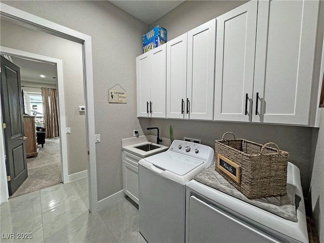 2891 S Rainbow Ave, Pahrump, NV 89048 - washroom with cabinet space, light marble finish flooring, and washer and clothes dryer