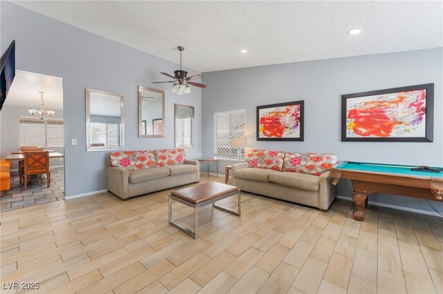 1012 Greystone Dr, Las Vegas, NV 89108 - living room with a textured ceiling, light wood finished floors, a chandelier, ceiling fan, and billiards