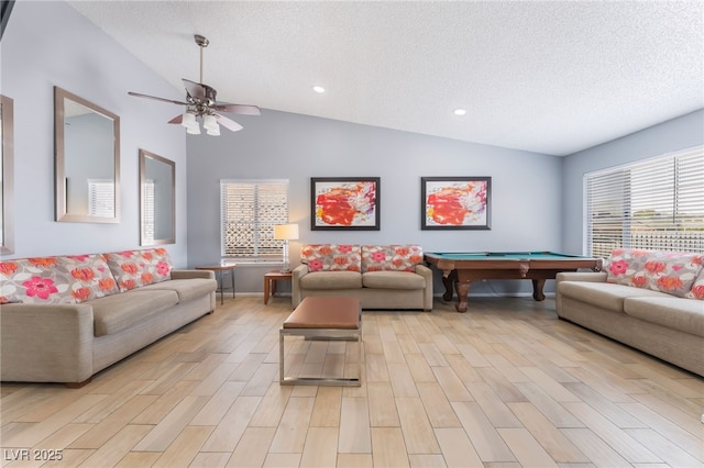 1012 Greystone Dr, Las Vegas, NV 89108 - living room with lofted ceiling, billiards, ceiling fan, light wood-style flooring, and a textured ceiling