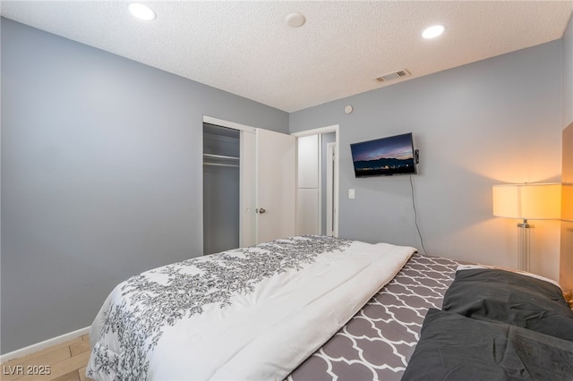 1012 Greystone Dr, Las Vegas, NV 89108 - bedroom featuring a closet, a textured ceiling, and recessed lighting