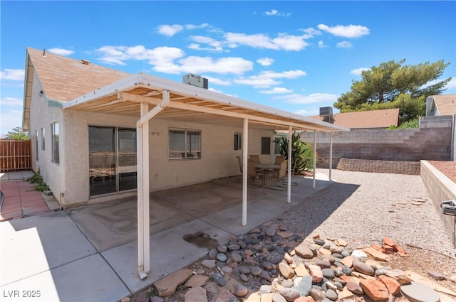 1012 Greystone Dr, Las Vegas, NV 89108 - rear view of house featuring a fenced backyard, stucco siding, and a patio