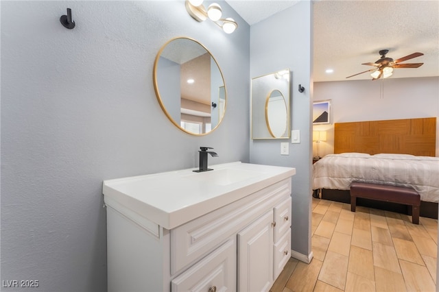 1012 Greystone Dr, Las Vegas, NV 89108 - bathroom with vanity, ceiling fan, and wood finished floors