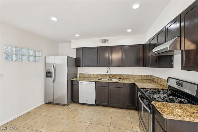 882 Westminster Ave, Las Vegas, NV 89119 - kitchen featuring stainless steel appliances, ventilation hood, light stone countertops, dark brown cabinetry, and light tile patterned floors