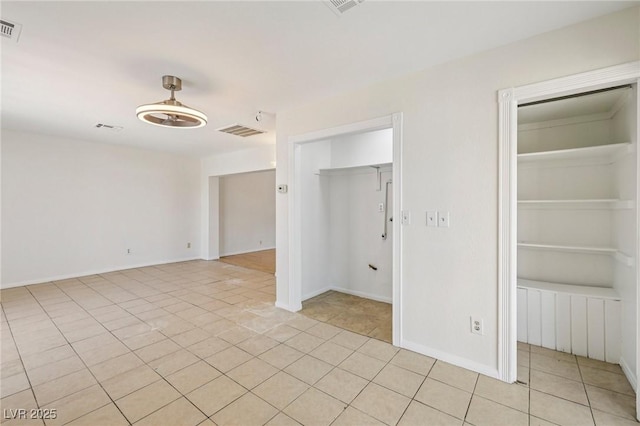 882 Westminster Ave, Las Vegas, NV 89119 - spare room featuring light tile patterned flooring and baseboards