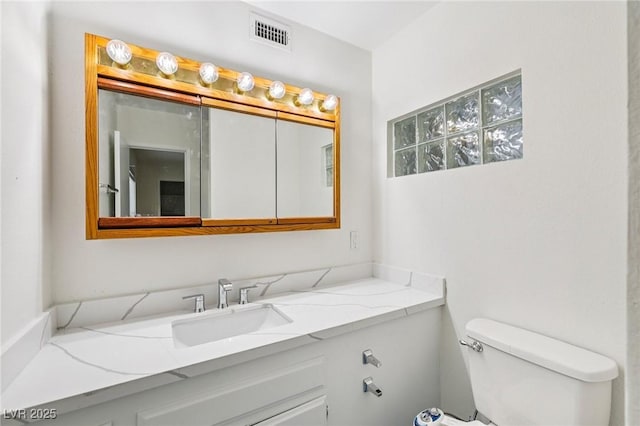 882 Westminster Ave, Las Vegas, NV 89119 - bathroom featuring toilet and vanity