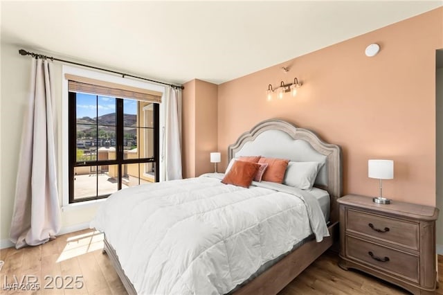 29 Montelago Blvd Unit 131, Henderson, NV 89011 - bedroom with light wood-type flooring and baseboards