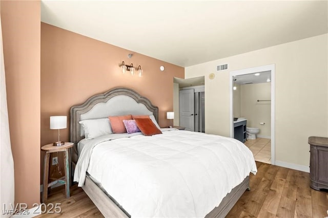 29 Montelago Blvd Unit 131, Henderson, NV 89011 - bedroom with wood finished floors and ensuite bathroom