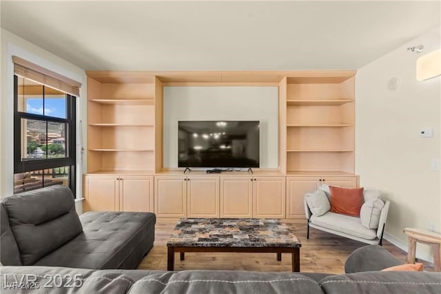29 Montelago Blvd Unit 131, Henderson, NV 89011 - living room with built in shelves and wood finished floors