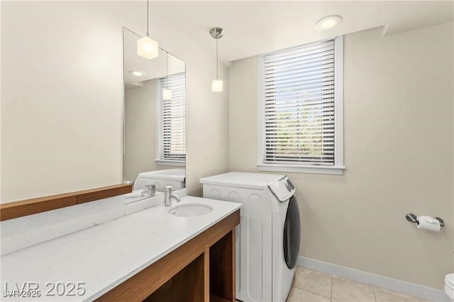 29 Montelago Blvd Unit 131, Henderson, NV 89011 - washroom featuring light tile patterned floors, healthy amount of natural light, and washer / clothes dryer