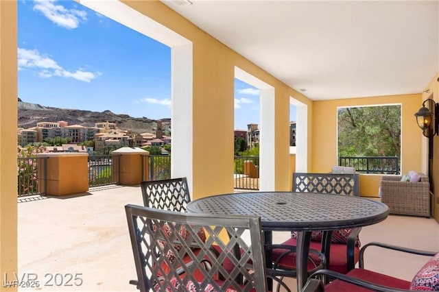 29 Montelago Blvd Unit 131, Henderson, NV 89011 - patio / terrace with a mountain view and outdoor dining space