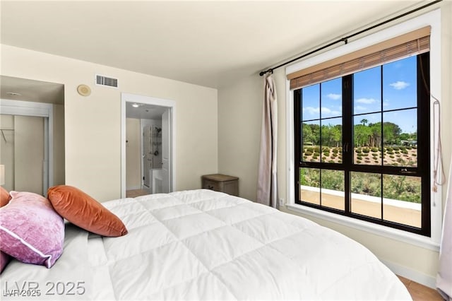 29 Montelago Blvd Unit 131, Henderson, NV 89011 - bedroom featuring baseboards and connected bathroom