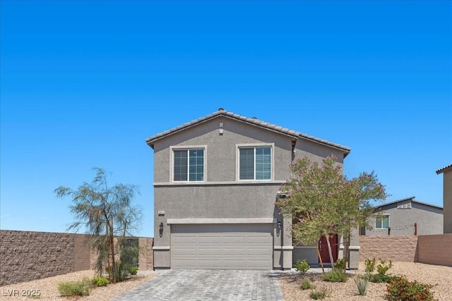 9054 Tangerine Tree Ct, Las Vegas, NV 89113 - traditional-style home featuring decorative driveway, stucco siding, and an attached garage