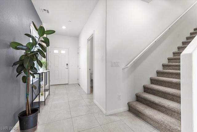9054 Tangerine Tree Ct, Las Vegas, NV 89113 - entrance foyer featuring stairway, light tile patterned flooring, and recessed lighting