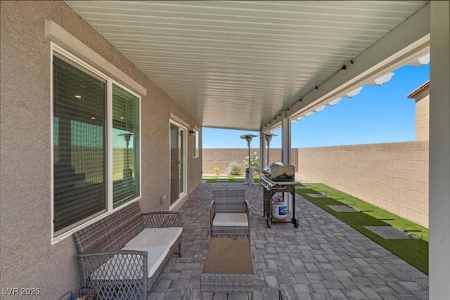 9054 Tangerine Tree Ct, Las Vegas, NV 89113 - fenced backyard featuring a patio area and a grill