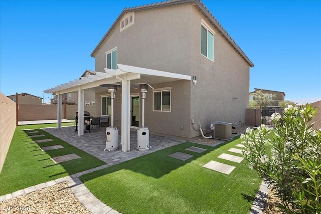 9054 Tangerine Tree Ct, Las Vegas, NV 89113 - rear view of house with a fenced backyard, stucco siding, a pergola, and a patio area