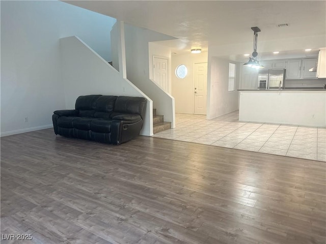 6250 W Flamingo Rd Unit 88, Las Vegas, NV 89103 - living room with stairs and light wood finished floors