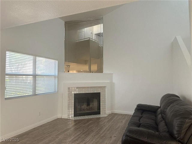 6250 W Flamingo Rd Unit 88, Las Vegas, NV 89103 - living area featuring wood finished floors and a tile fireplace