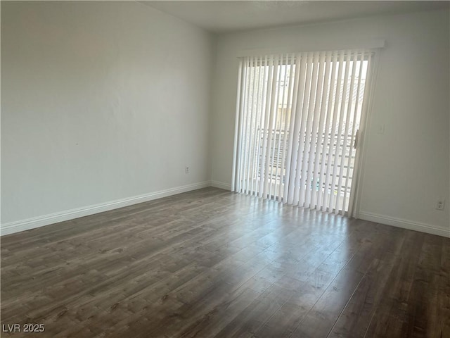6250 W Flamingo Rd Unit 88, Las Vegas, NV 89103 - unfurnished room featuring dark wood-style flooring and baseboards