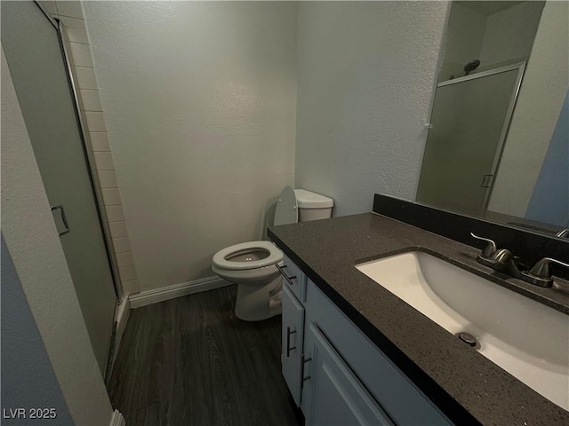 6250 W Flamingo Rd Unit 88, Las Vegas, NV 89103 - full bathroom featuring vanity, wood finished floors, and a stall shower