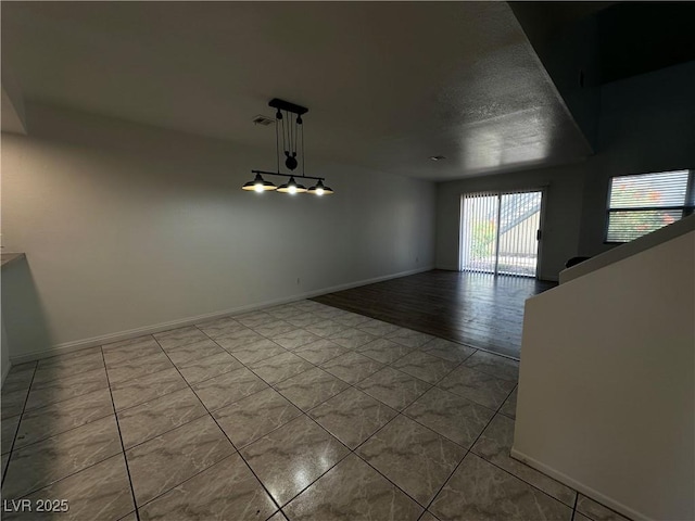 6250 W Flamingo Rd Unit 88, Las Vegas, NV 89103 - spare room featuring baseboards and tile patterned flooring