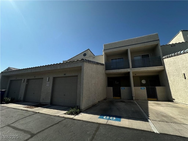 6250 W Flamingo Rd Unit 88, Las Vegas, NV 89103 - view of front of house featuring stucco siding and an attached garage