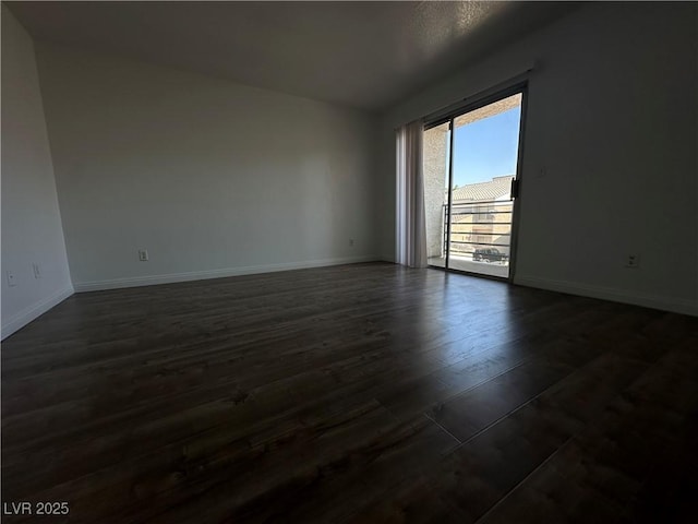 6250 W Flamingo Rd Unit 88, Las Vegas, NV 89103 - empty room with baseboards and dark wood-style floors