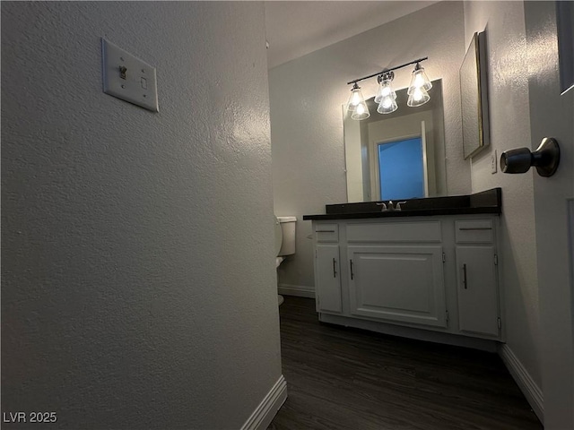 6250 W Flamingo Rd Unit 88, Las Vegas, NV 89103 - half bathroom with wood finished floors and vanity
