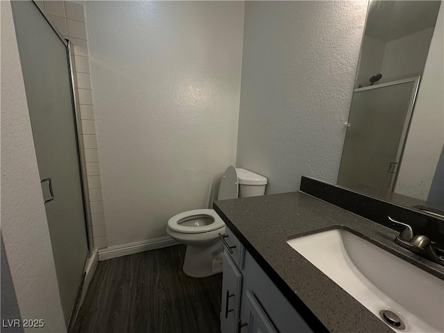 6250 W Flamingo Rd Unit 88, Las Vegas, NV 89103 - bathroom featuring vanity, wood finished floors, and a stall shower