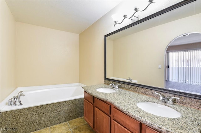 1836 N Decatur Blvd Unit 203, Las Vegas, NV 89108 - bathroom featuring a garden tub, double vanity, and tile patterned flooring