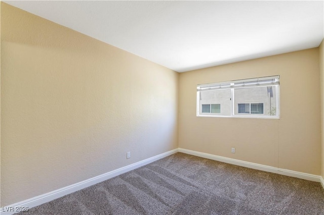 1836 N Decatur Blvd Unit 203, Las Vegas, NV 89108 - carpeted empty room with baseboards