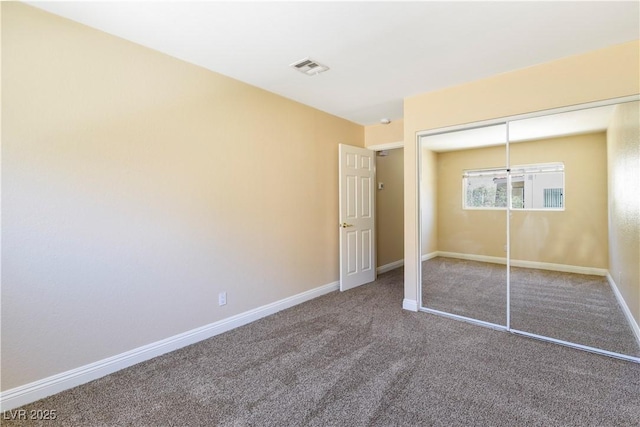 1836 N Decatur Blvd Unit 203, Las Vegas, NV 89108 - unfurnished bedroom featuring carpet and a closet