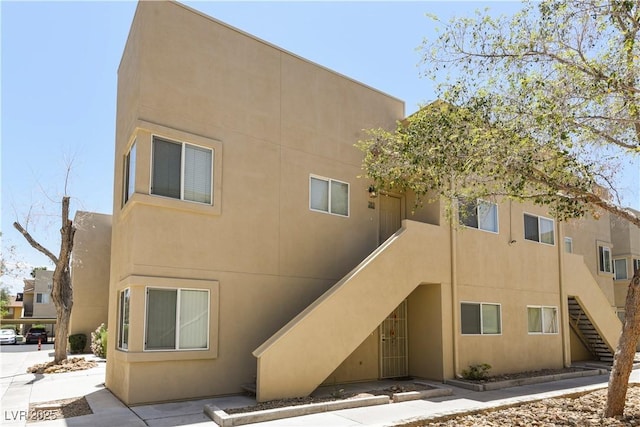1836 N Decatur Blvd Unit 203, Las Vegas, NV 89108 - back of property with stairway and stucco siding