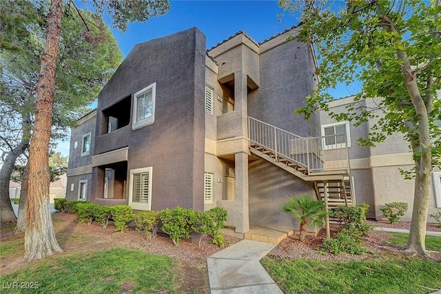 5250 S Rainbow Blvd Unit 1057, Las Vegas, NV 89118 - view of front facade featuring stairs and stucco siding