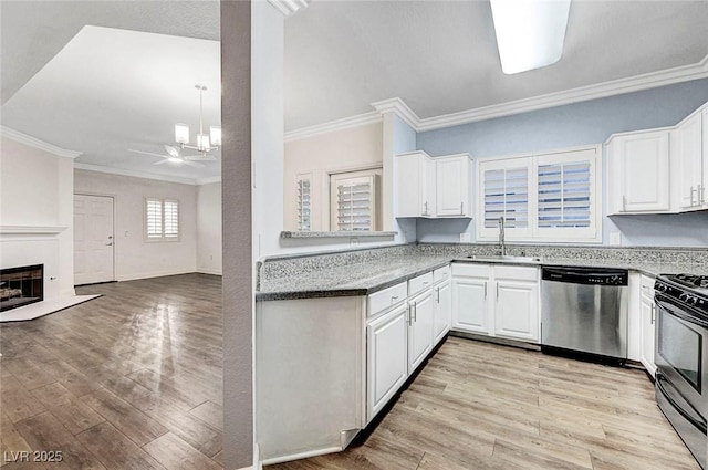 5250 S Rainbow Blvd Unit 1057, Las Vegas, NV 89118 - kitchen with appliances with stainless steel finishes, ornamental molding, open floor plan, light wood-type flooring, and white cabinetry