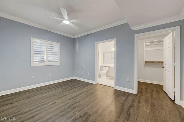 5250 S Rainbow Blvd Unit 1057, Las Vegas, NV 89118 - unfurnished bedroom with dark wood-type flooring, crown molding, a walk in closet, ensuite bathroom, and a closet