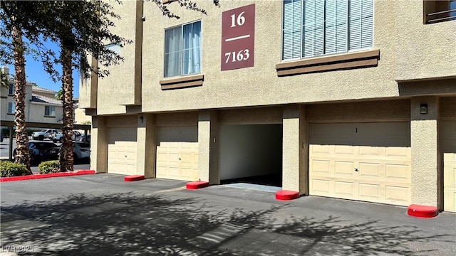7163 S Durango Dr Unit 113, Las Vegas, NV 89113 - view of property featuring an attached garage