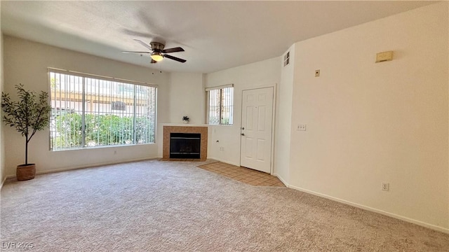 7163 S Durango Dr Unit 113, Las Vegas, NV 89113 - unfurnished living room featuring light carpet, a ceiling fan, and a fireplace