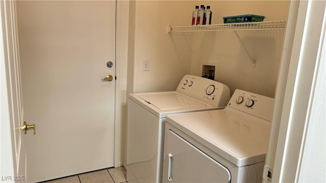 7163 S Durango Dr Unit 113, Las Vegas, NV 89113 - laundry area with washer and dryer and light tile patterned floors