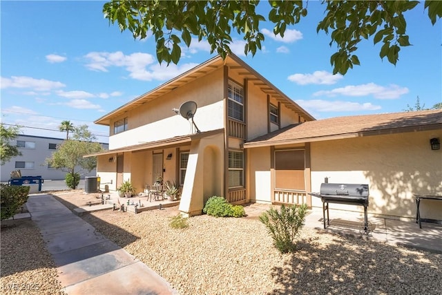 1407 Dorothy Ave Unit 2, Las Vegas, NV 89119 - rear view of property with a patio and stucco siding